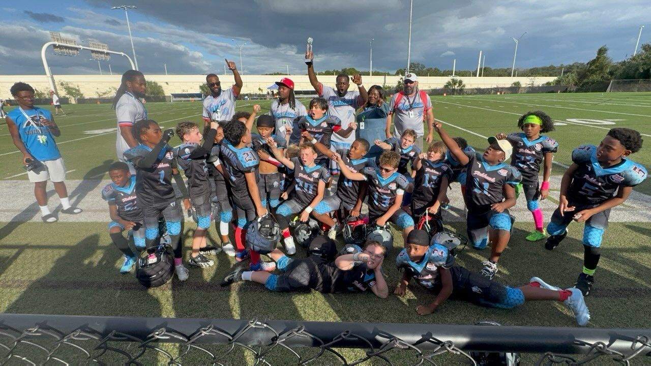 FishHawk Spartans 9U celebrating the 2026 D1 FYD Super Bowl win