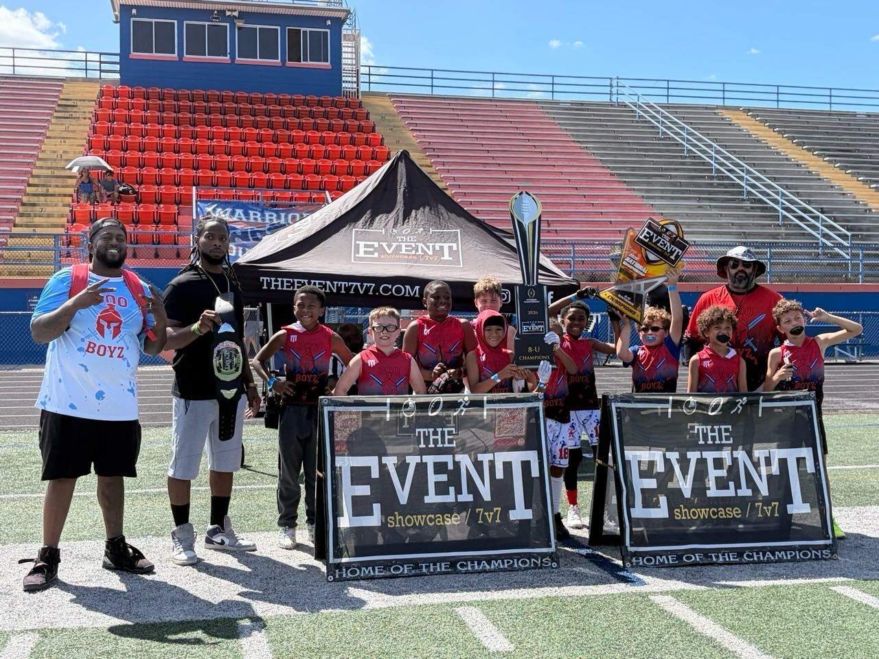 300 Boyz 8U with the national championship trophy at The Event 7v7